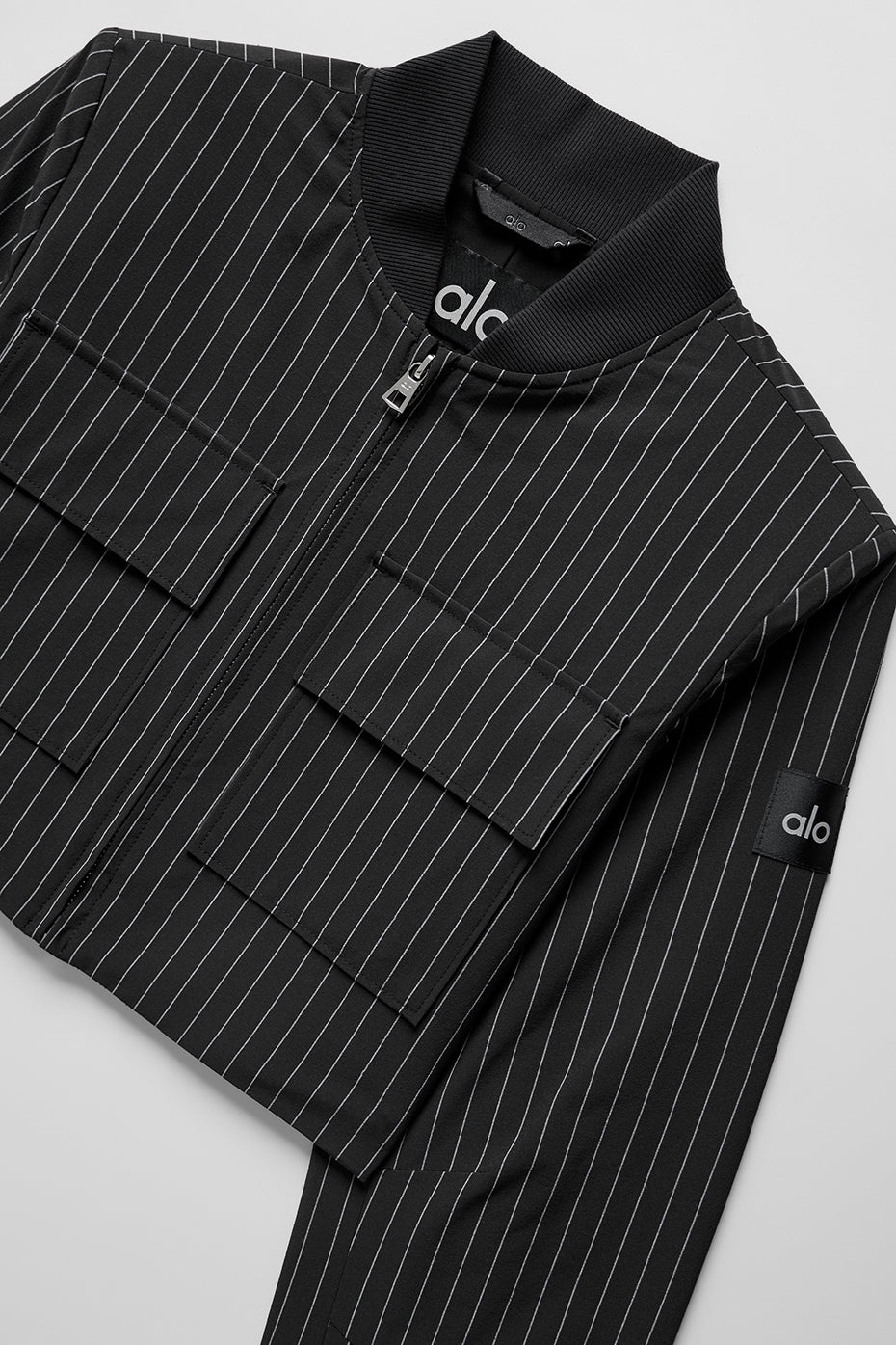 Veste courte à rayures fines avec fermeture éclair intégrale "RUPTURE DE STOCK"